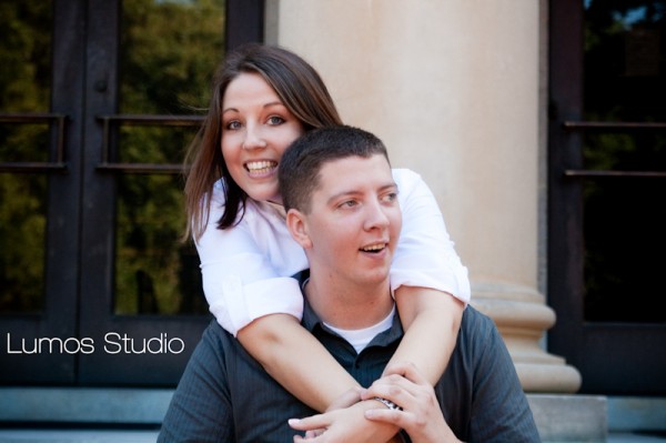 Leah rides on Greg's back in front of the McKissick Museum at USC