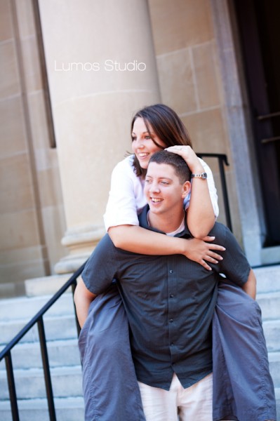 Leah rides on Greg's back in front of the McKissick Museum at USC