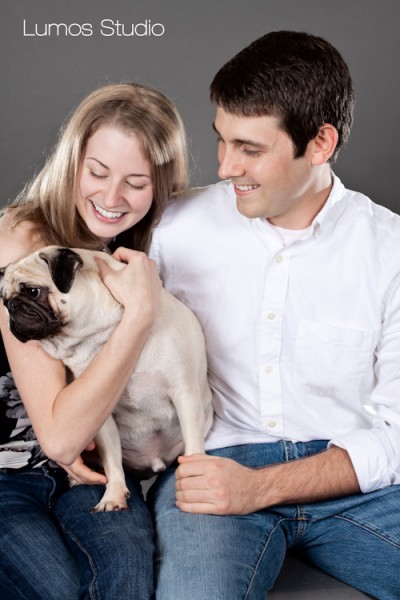 Engaged couple with their pug