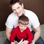 Ethan reads with his daddy