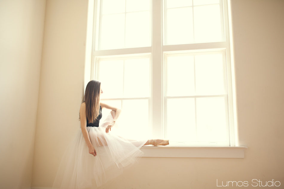 Ballerina sitting in window