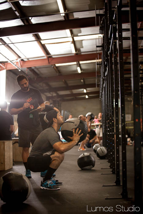 A man does wall ball during Carolina CrossFit's Famously Hot Showdown